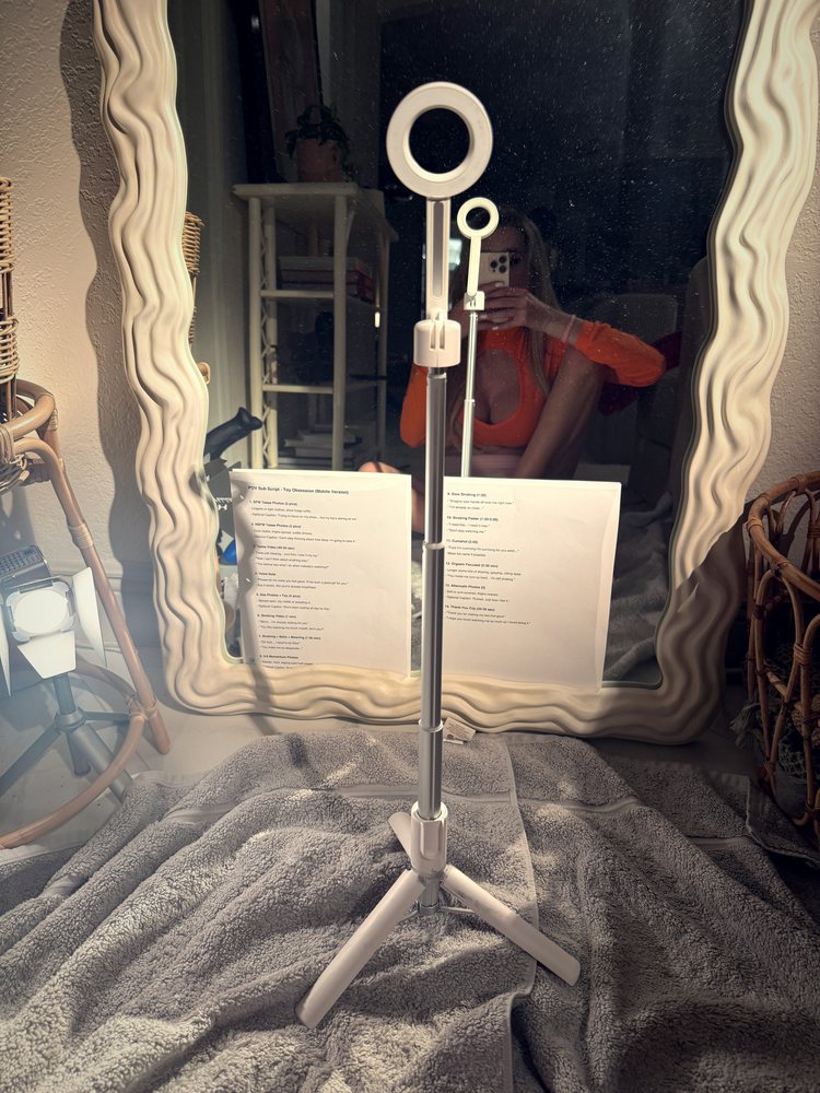 Lana's ring light and mirror setup with a script on the stand